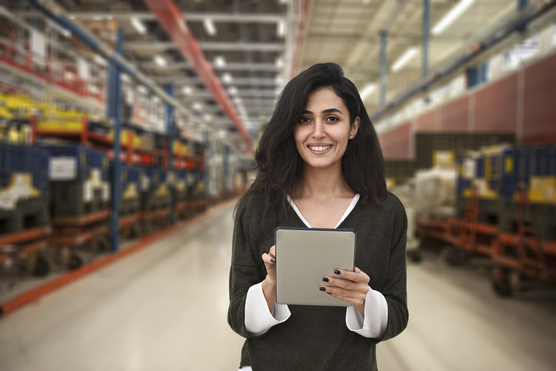 Person in Warehouse Consults BlueVolt LMS for Manufacturers